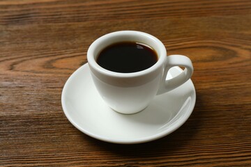Cup of coffee on wooden background