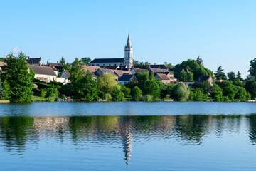 Dampierre-en-Burly view from the pond in Europe, France, Centre Val de Loire, Loiret, Dampierre en Burly, in summer, on a sunny day.