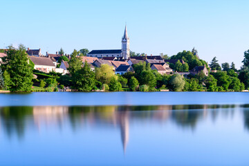 Fototapeta premium Dampierre-en-Burly view from the pond in Europe, France, Centre Val de Loire, Loiret, Dampierre en Burly, in summer, on a sunny day.