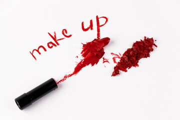 A Creative Display of Makeup Art: A Lipstick Smudge with the Words 'Make Up' Artistically Written...