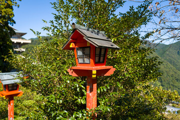 Lanterns on the path to Kumano-Nachi Taisha in Nachisan in Asia, Japan, Kansai, Nachisan, in summer, on a sunny day.