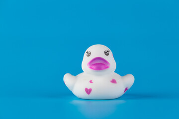 Charming Rubber Duck with Heart Designs Against a Bright Blue Background: Perfect for Playtime and Decor