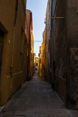 Fototapeta premium The alleys of the historic city center in Castelsardo in Europe, Italy, Sardinia, Castelsardo, in summer, on a sunny day.
