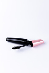 Elegant Collection of Makeup Essentials Featuring a Stunning Black Mascara and Pink Packaging for a Chic Look