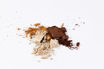 An Assortment of Natural Powders on a White Surface, Showcasing Various Textures and Tones in a Beautifully Captivating Display of Colors and Consistencies