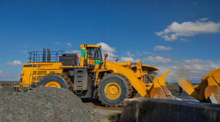 wheel loader machine at the diamond mine, open pit mining operation.