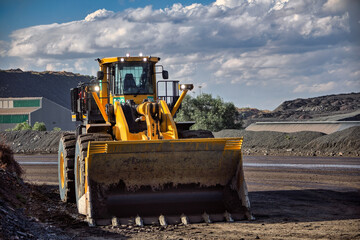 wheel loader, heavy equipment, at a diamond open pit mine, african mining, yellow front end loader...