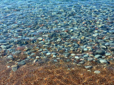 Clear sea on pebbles beach.