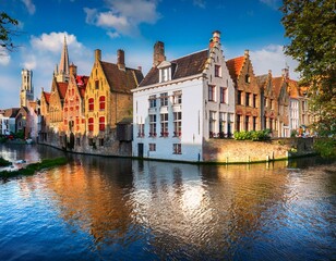 colorful historic buildings along a canal in bruges