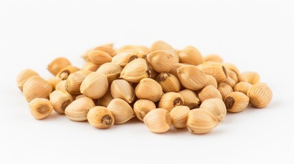 A pile of light brown seeds is displayed against a white background, showcasing their smooth texture and distinct shape.