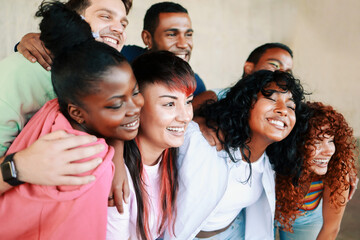 Diverse group of friends having fun smiling outdoor in summer day - Young people celebrate holiday...
