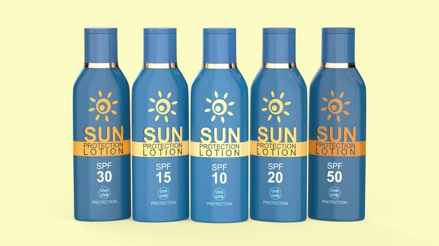 Row of sunscreen lotions with different SPF numbers on yellow background