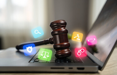 Judge's hammer on a laptop. Legal assistance. Legislative regulation of digital systems, cyberspace...