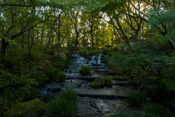 The waterfall in Koko En Garden in Himeji in Asia, Japan, Kansai, Himeji, in summer, on a sunny day.