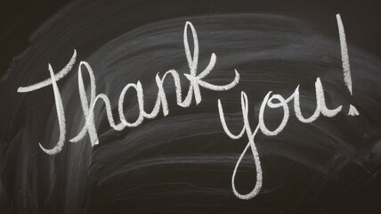 The words thank you are written in white chalk