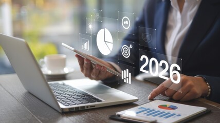 Businessperson plans for the year ahead using various digital tools