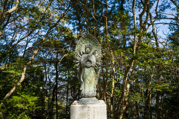 Obraz premium The statue on the path around the Engyoji Maniden in Himeji in Asia, Japan, Kansai, Himeji, in summer, on a sunny day.