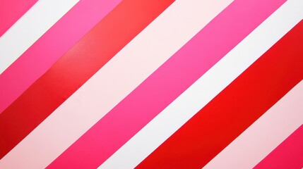 A vibrant wall featuring diagonal stripes in shades of pink and red, creating a playful and energetic atmosphere.