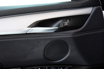 Lux Car inside door chrome handle. Window lifters control. Leather Door trim. Speaker in car door. 