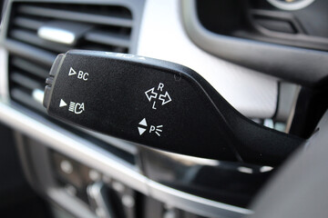 The light knob in the car. Multifunction Headlight Console Control Switch knob. Car interior with...