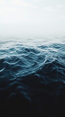 Dark ocean waves with dramatic white foam and deep blue textures