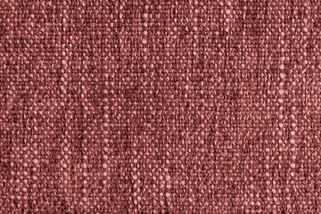 Red Jacquard fabric with large loose woven, coarse weave texture upholstery cloth. Textile background, furniture textile material, wallpaper, backdrop. Cloth structure close up, macro.