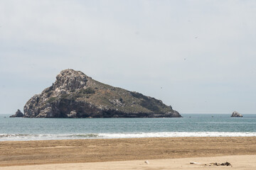 Rocky islet off the beach at Isla de la Piedra, in Mazatlan, Mexico
