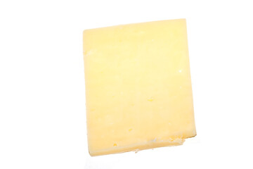 Close up of chedder cheese slices on a white background