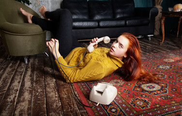 young woman sitting on the floor with phone