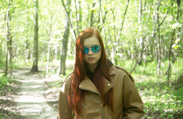 portrait of a young pretty woman in a forest