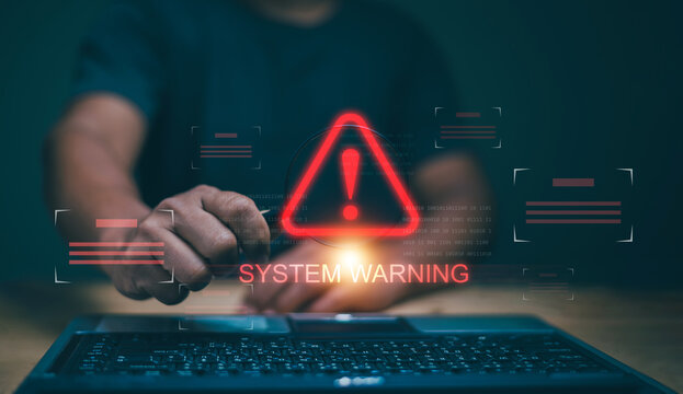 Cyber security concept, Man holding magnifying glass with caution warning sign for notification error maintenance and virus detected, Ransomware, Spyware, Hacker attacks. Detection dangerous worms. - Powered by Adobe