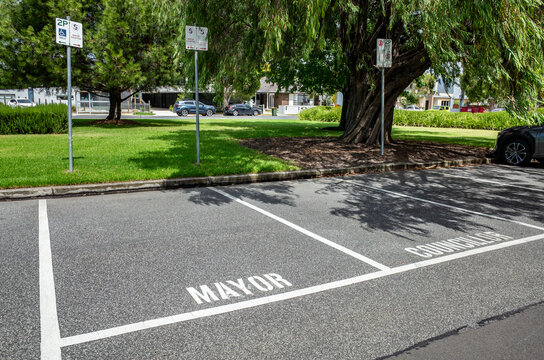 The designated parking spaces in a public area, specifically marked for "Mayor" and "Councillor," indicating reserved spots for local officials. Civic function and public amenity in Altona, Melbourne 