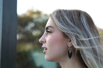 Wind Blowing On A Confident Young Woman 