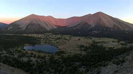 Pink Sunset Over Mountain Lake and Valley