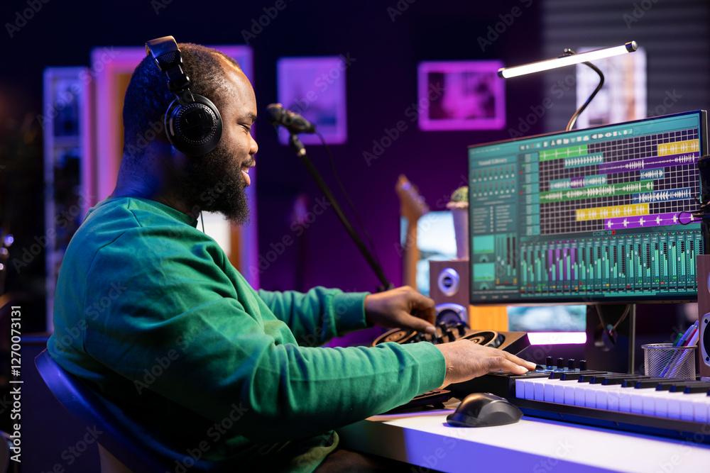 Aufkleber audio technician editing tunes on mixing console to adjust volume levels, twisting pre amp knobs in 