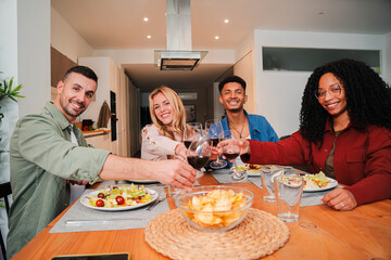 Group of Friends Enjoying a Joyous Dinner Celebration with Toasting and Wine Glasses in a dinning reunion, Highlighting the Spirit of Togetherness and Friendship Over Delicious Food and Drinks