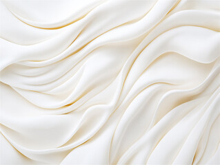 Fototapeta premium An abstract close-up of flowing white fabric with elegant curves and delicate folds. The smooth texture and soft waves create a sense of sophistication and minimalism.