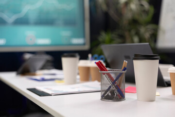 Empty meeting office space in an enterprise used for workers to attend conferences or debates and make crucial decisions. Boardroom equipped with an interactive board and tools.