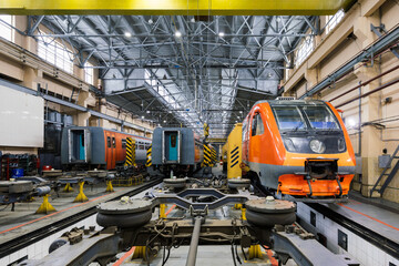 Electric trains at service in train repair workshop
