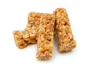 Honey bars with peanuts, sesame and sunflower seeds isolated