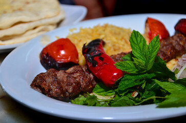 Adana Wrap Kebab with Cracked Wheat Rice and Green Vegetables