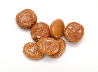 Caramel candies isolated on white background