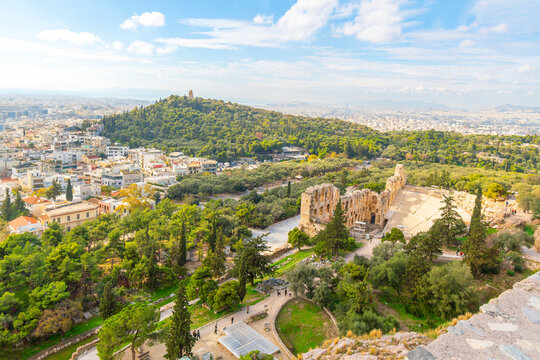 View of the ancient Odeon of Herodes Atticus, Philopappos Hill, and the city of Athens from Acropolis Hill in Athens, Greece.	