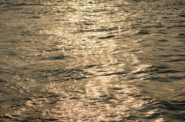 Shimmering water surface at sunset