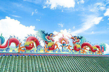 Vibrant dragon sculptures on a temple roof