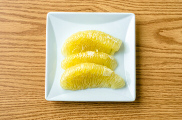 Fresh citrus segments on a plate