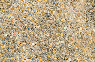 Textured surface of mixed gravel and stones.
