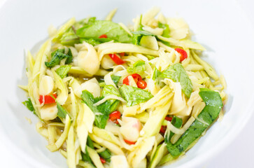 Spicy Mango Salad with vegetables and chili peppers