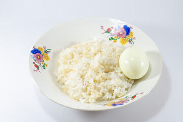 Plate of rice with a boiled egg on the side