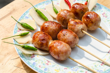 Thai Grilled Sausages in plate with green chilies